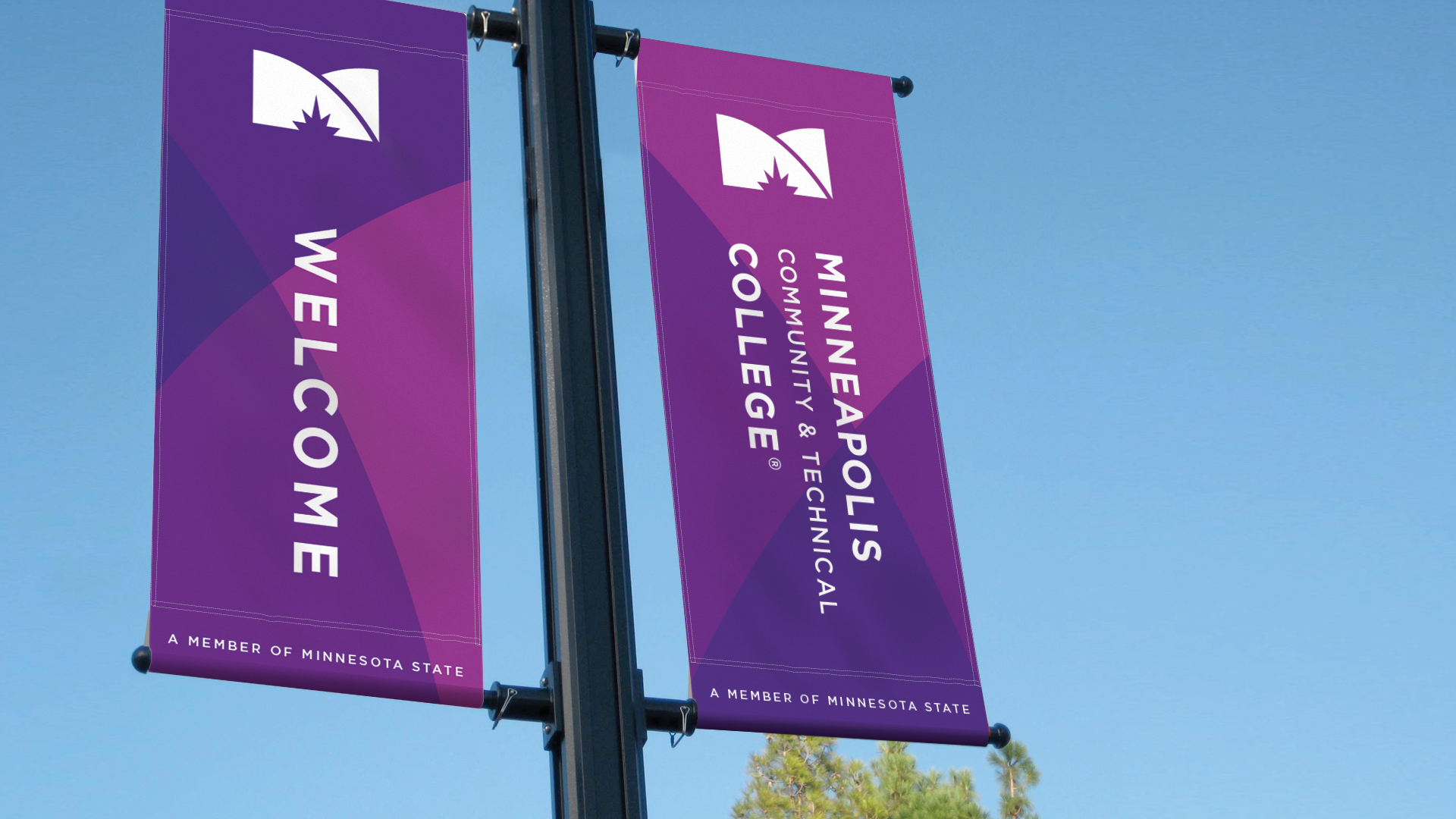 The Minneapolis College brand design logo on street banners in purple with blue sky background.