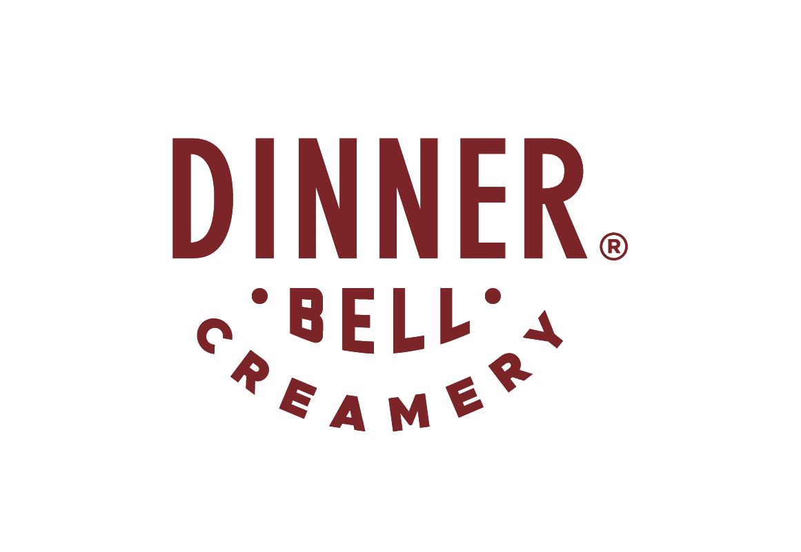 The Dinner Bell Creamery brand name design in red over transparent background.